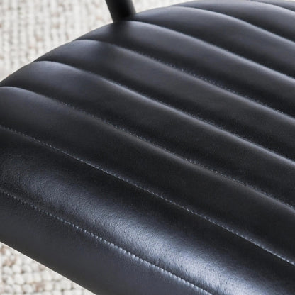 Preston Leather Dining Chair by Classic Home in jet black. Made from top grain leather, iron in a transitional style.