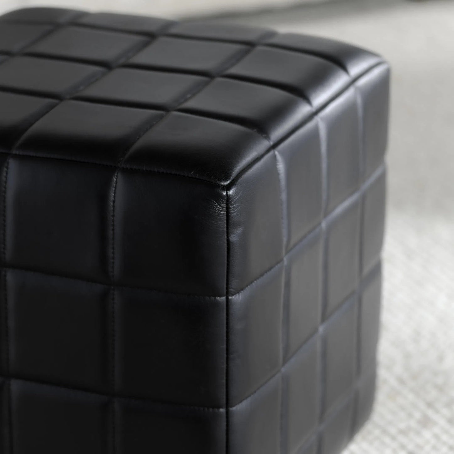 004 SI-2238876 | Closeup | Briar 18" Square Tufted Leather Ottoman by Classic Home in black. Made from top grain leather, mango wood in a modern style.