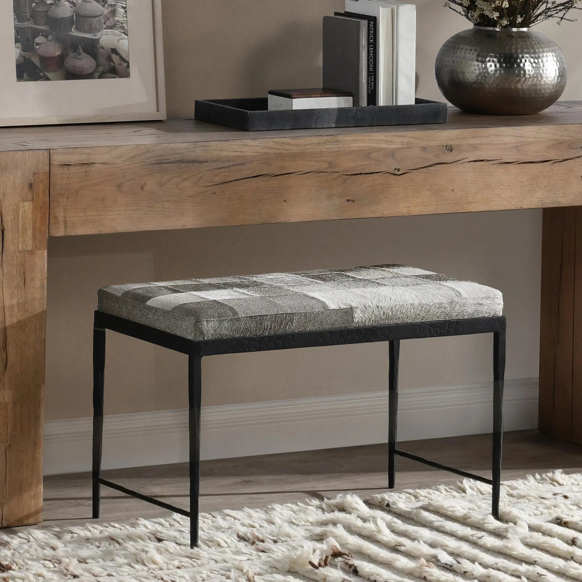 Achen Leather Hide Ottoman Bench by Classic Home. Made from hair on hide, iron in a transitional style.
