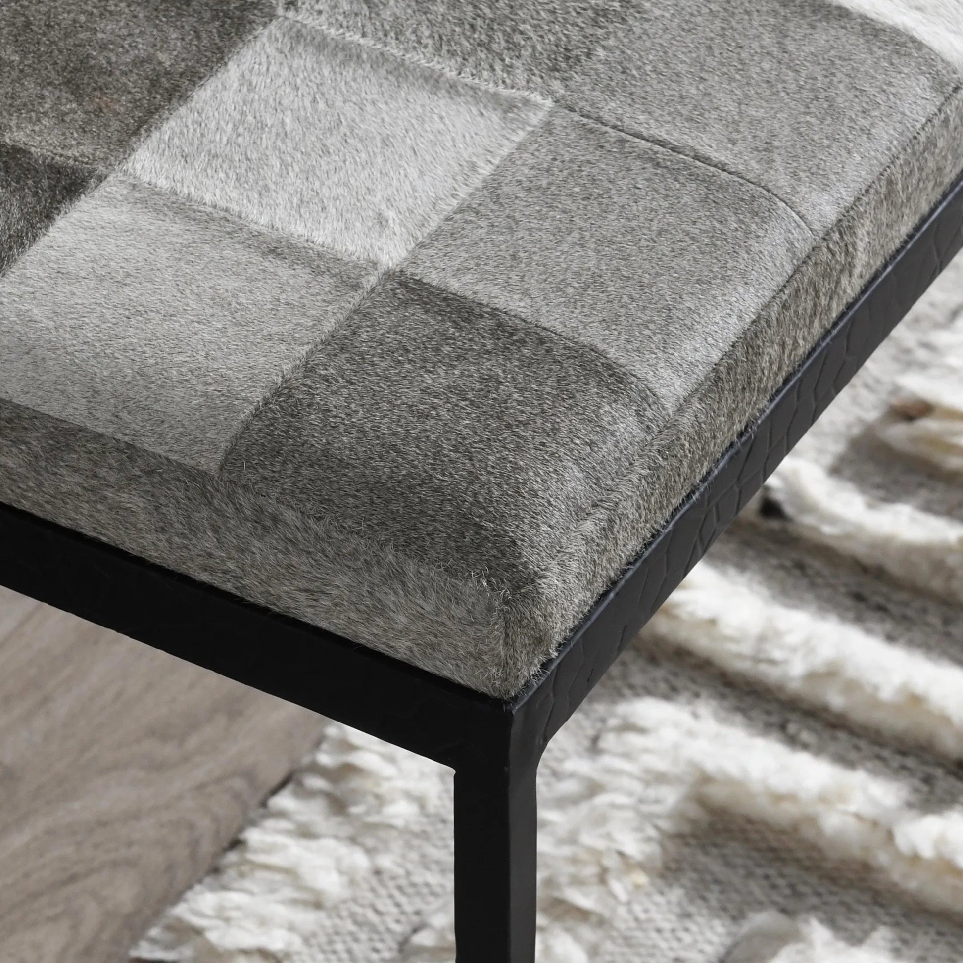 Achen Leather Hide Ottoman Bench by Classic Home. Made from hair on hide, iron in a transitional style.