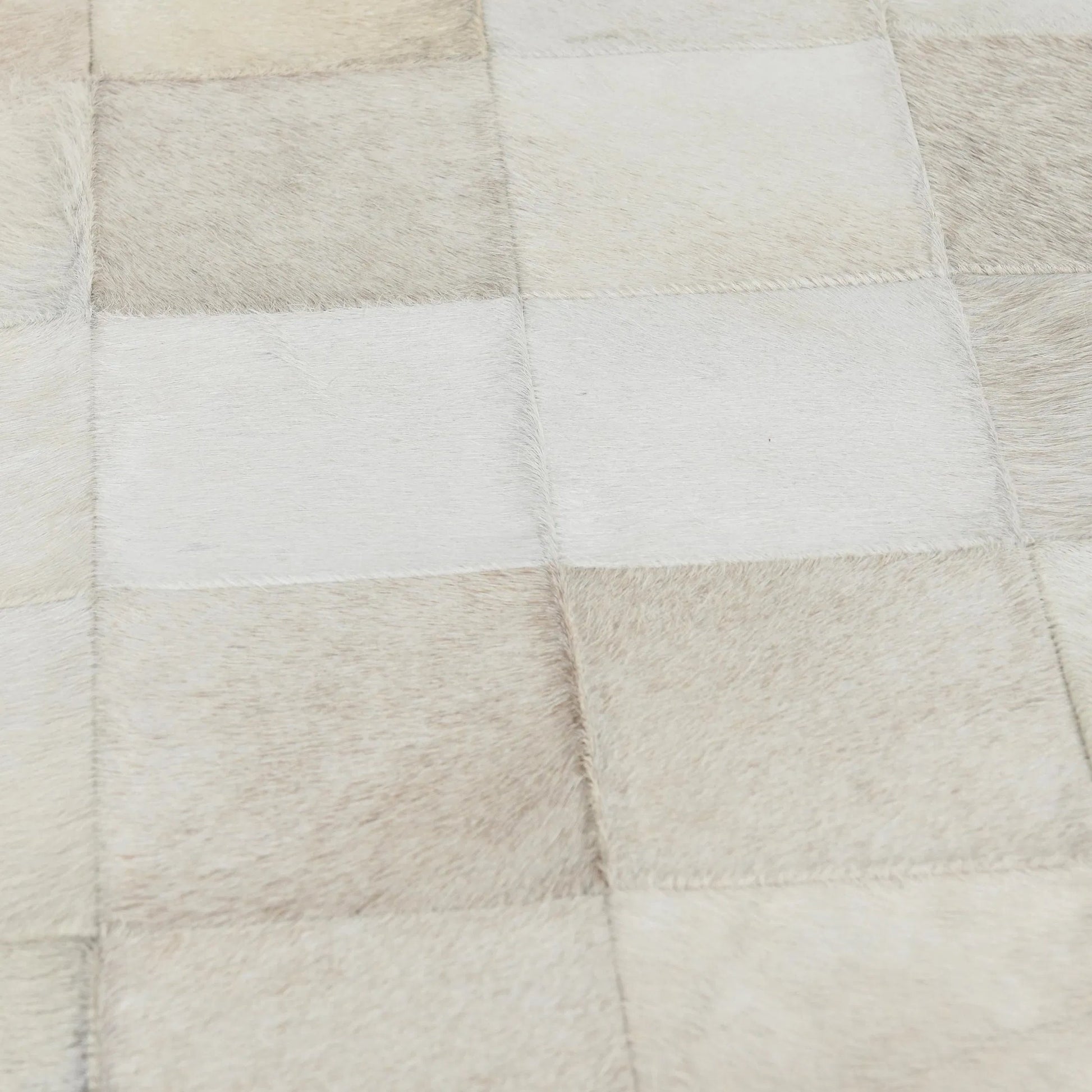 Achen Leather Hide Ottoman Bench by Classic Home. Made from hair on hide, iron in a transitional style.