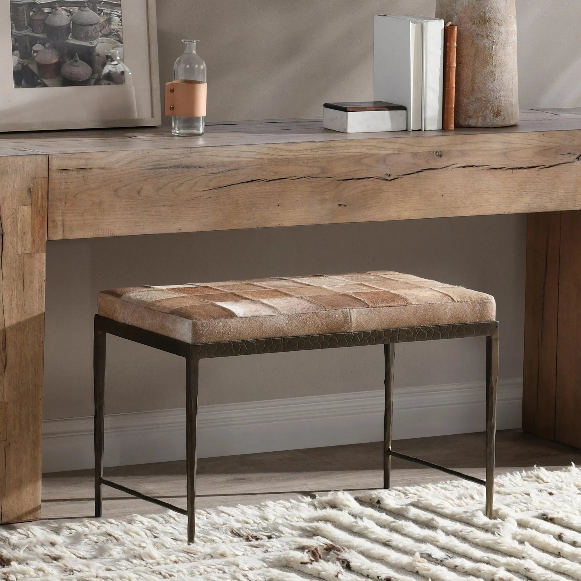 Achen Leather Hide Ottoman Bench by Classic Home. Made from hair on hide, iron in a transitional style.