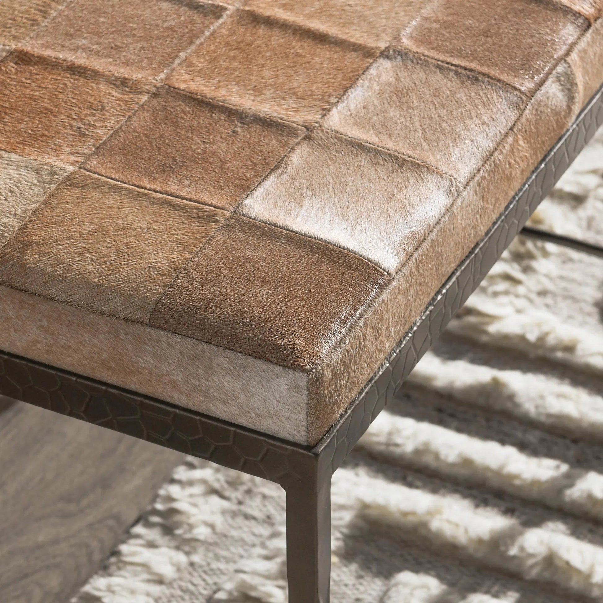 Achen Leather Hide Ottoman Bench by Classic Home. Made from hair on hide, iron in a transitional style.