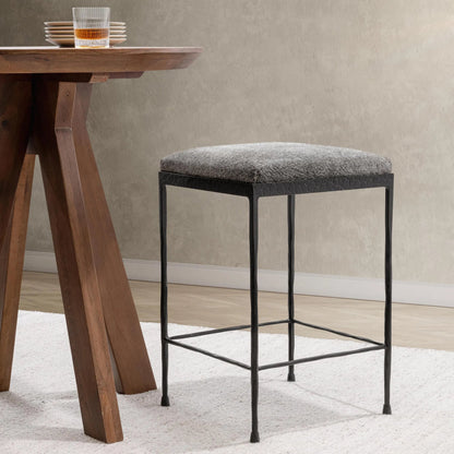 Bose Hide Leather Counter Stool by Classic Home. Made from embossed hammered iron, hair on hide in a modern style.