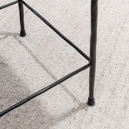 Bose Hide Leather Counter Stool by Classic Home. Made from embossed hammered iron, hair on hide in a modern style.