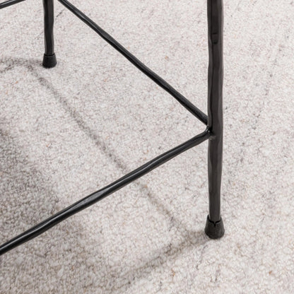 Bose Hide Leather Counter Stool by Classic Home. Made from embossed hammered iron, hair on hide in a modern style.