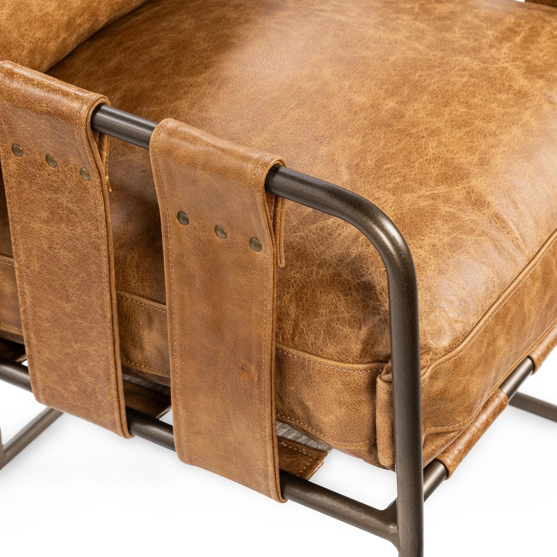 Strapling Leather Dining Chair by Classic Home. Made from top grain leather, iron in a traditional style.