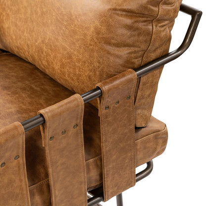 Strapling Leather Dining Chair by Classic Home. Made from top grain leather, iron in a traditional style.