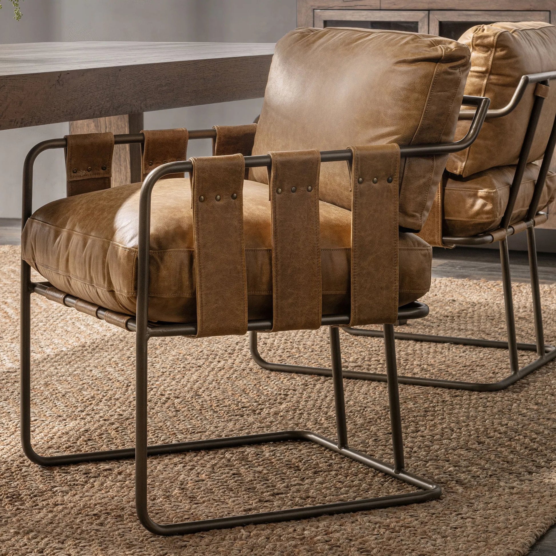 Strapling Leather Dining Chair by Classic Home. Made from top grain leather, iron in a traditional style.