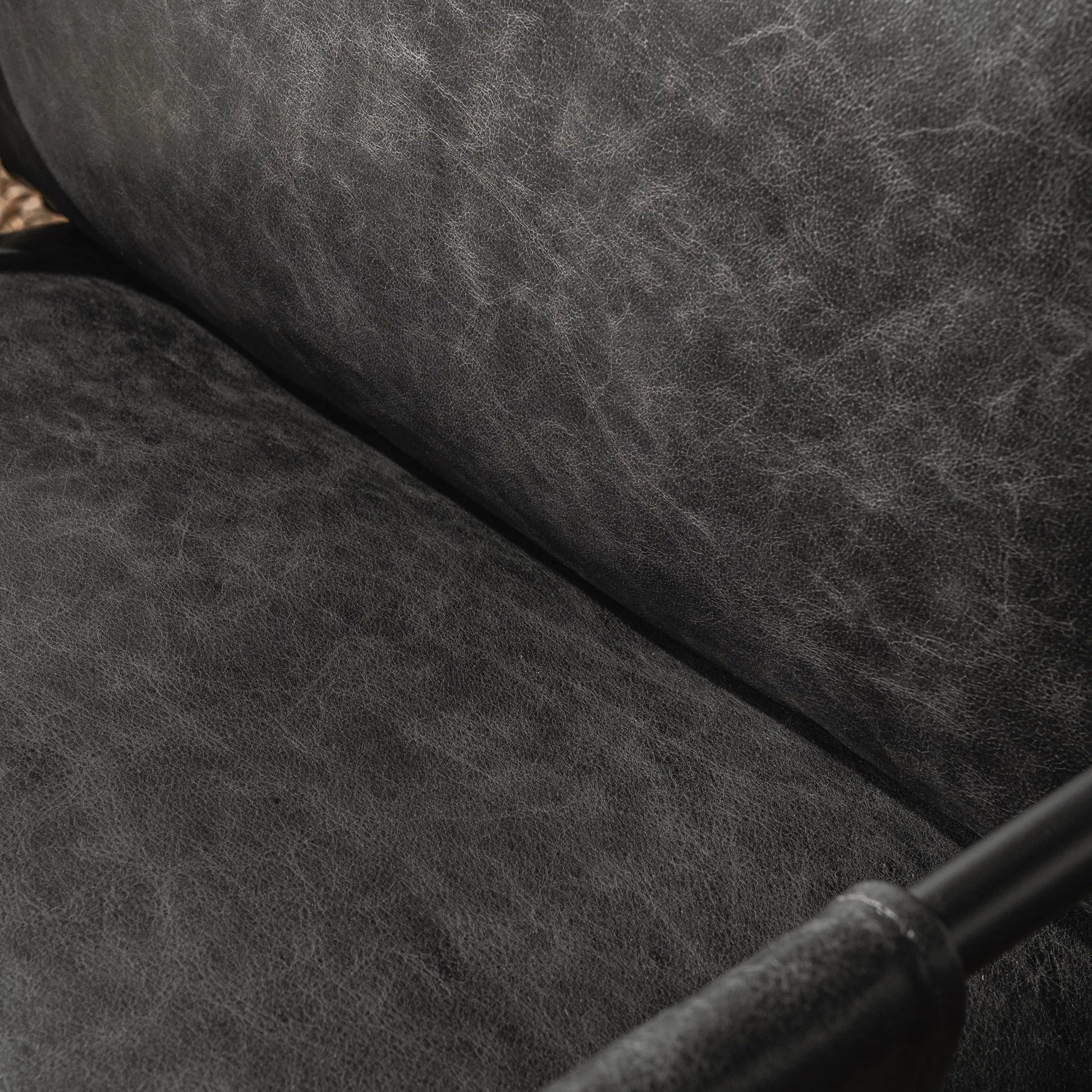 Strapling Leather Dining Chair by Classic Home. Made from top grain leather, iron in a traditional style.