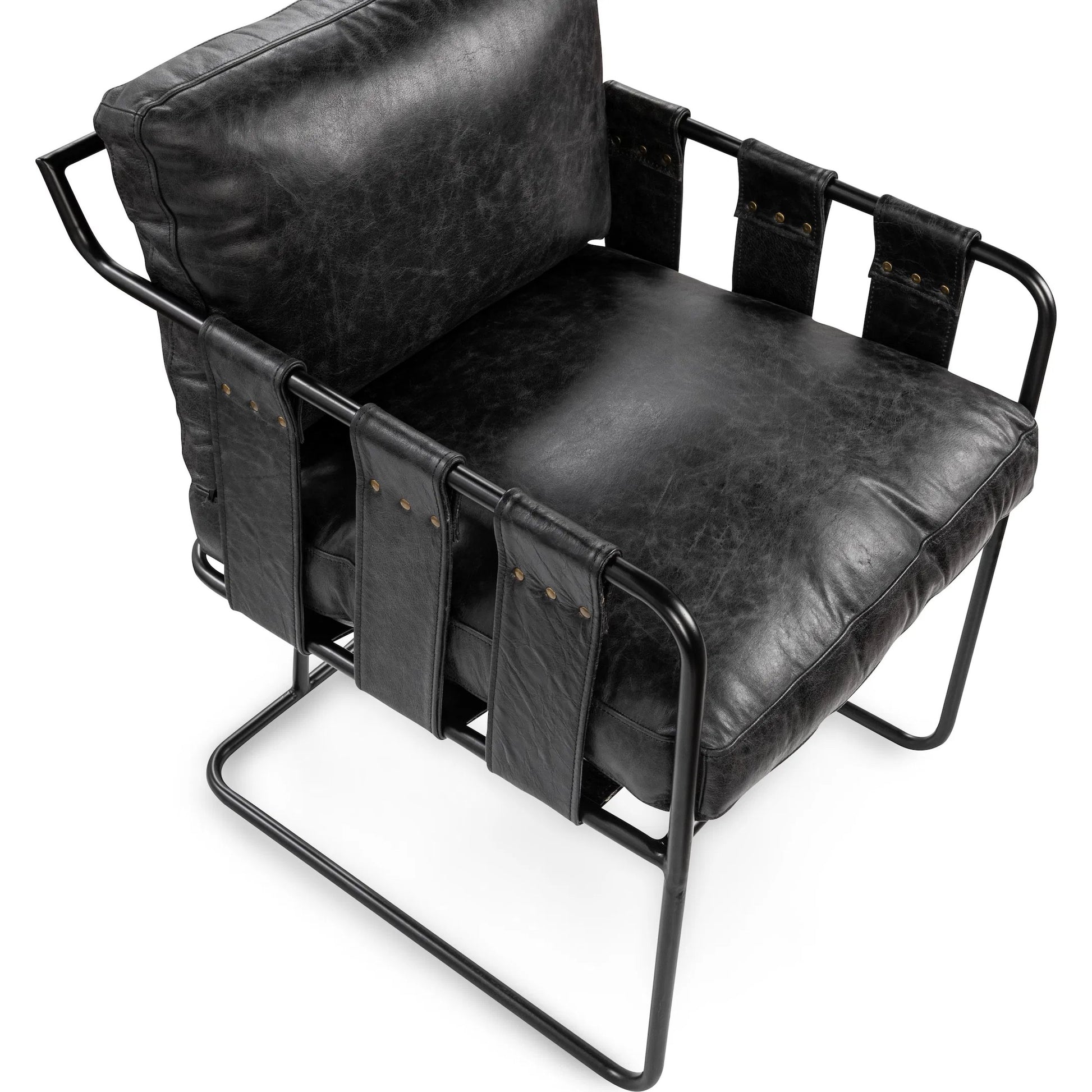 Strapling Leather Dining Chair by Classic Home. Made from top grain leather, iron in a traditional style.