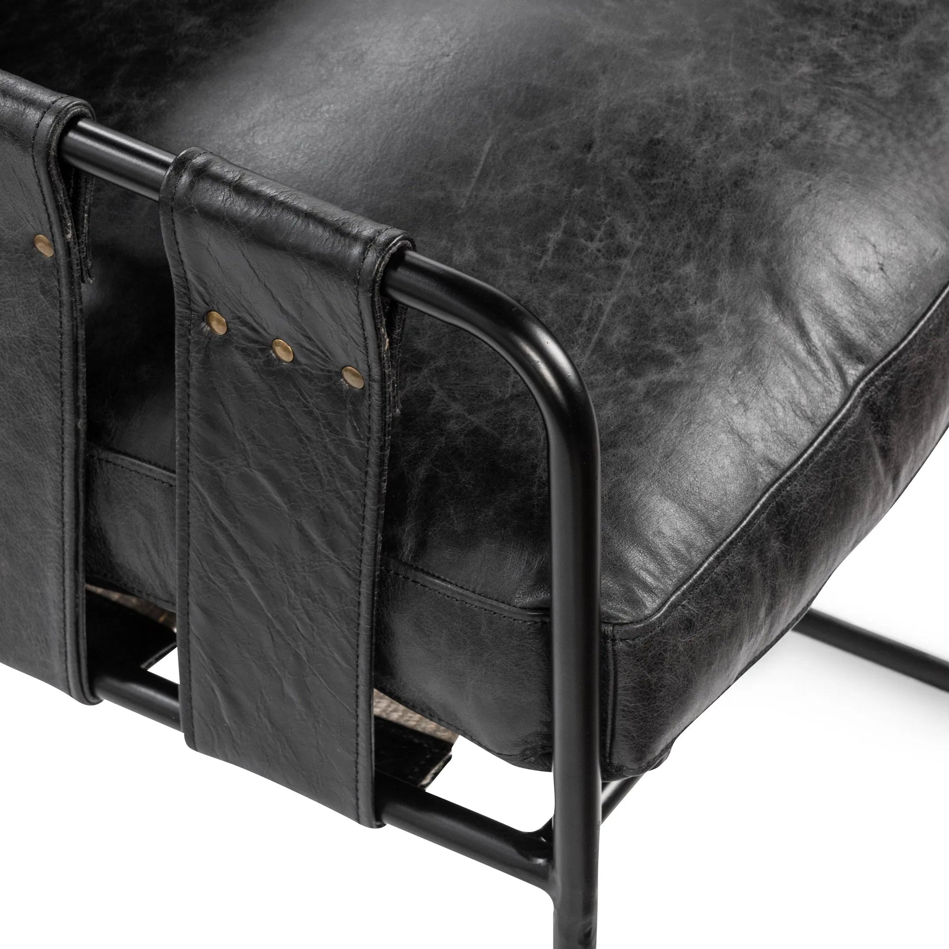 Strapling Leather Dining Chair by Classic Home. Made from top grain leather, iron in a traditional style.