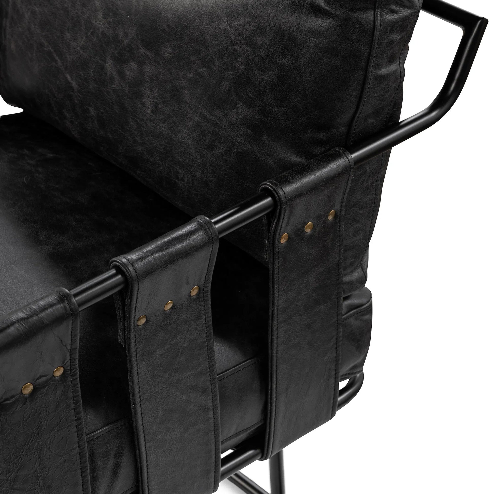 Strapling Leather Dining Chair by Classic Home. Made from top grain leather, iron in a traditional style.