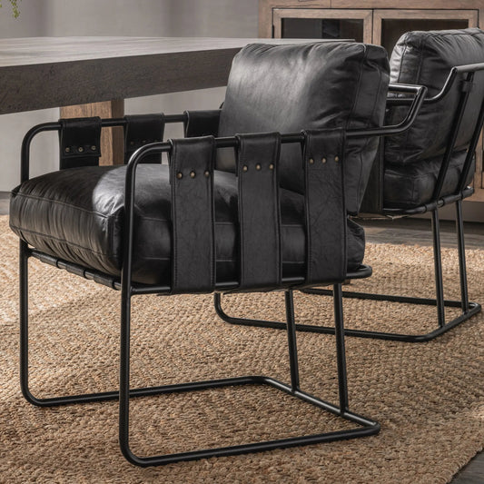 Strapling Leather Dining Chair by Classic Home. Made from top grain leather, iron in a traditional style.