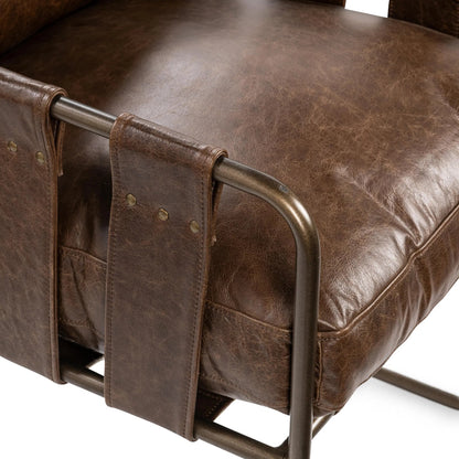 Strapling Leather Dining Chair by Classic Home. Made from top grain leather, iron in a traditional style.