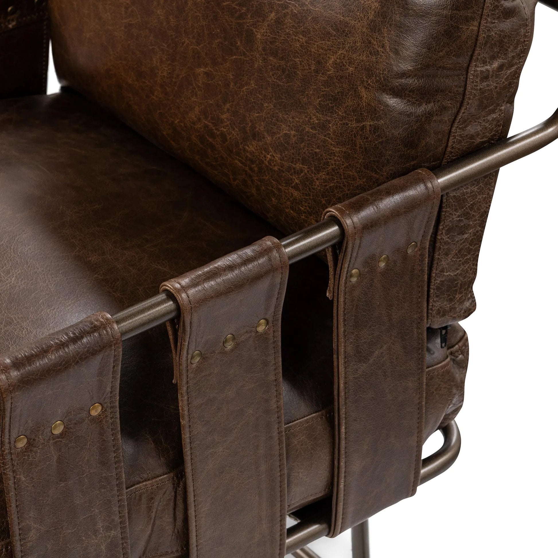 Strapling Leather Dining Chair by Classic Home. Made from top grain leather, iron in a traditional style.