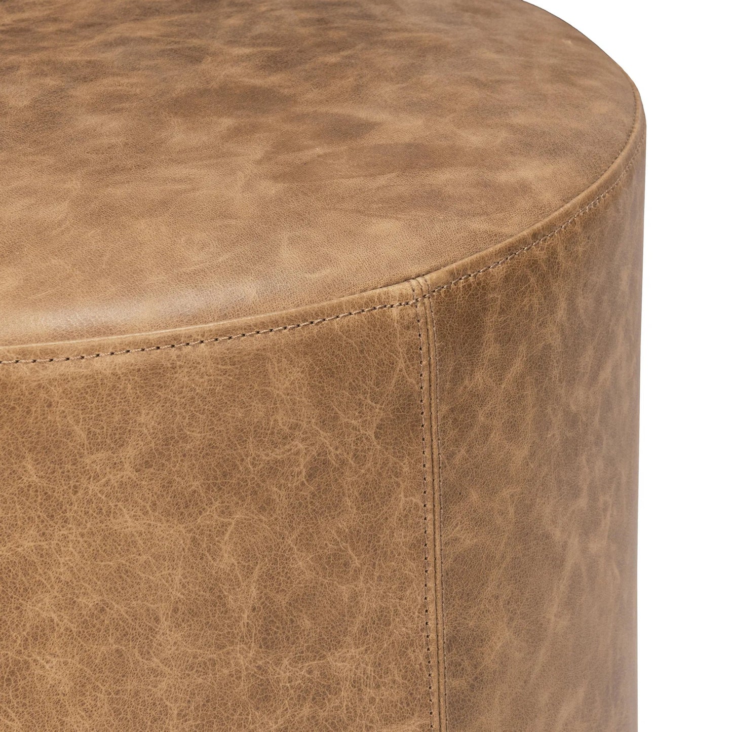 004 SI-2533223 | Closeup | Millo Round Ottoman by Classic Home in sedona brown. Made from top grain leather in a unique style.