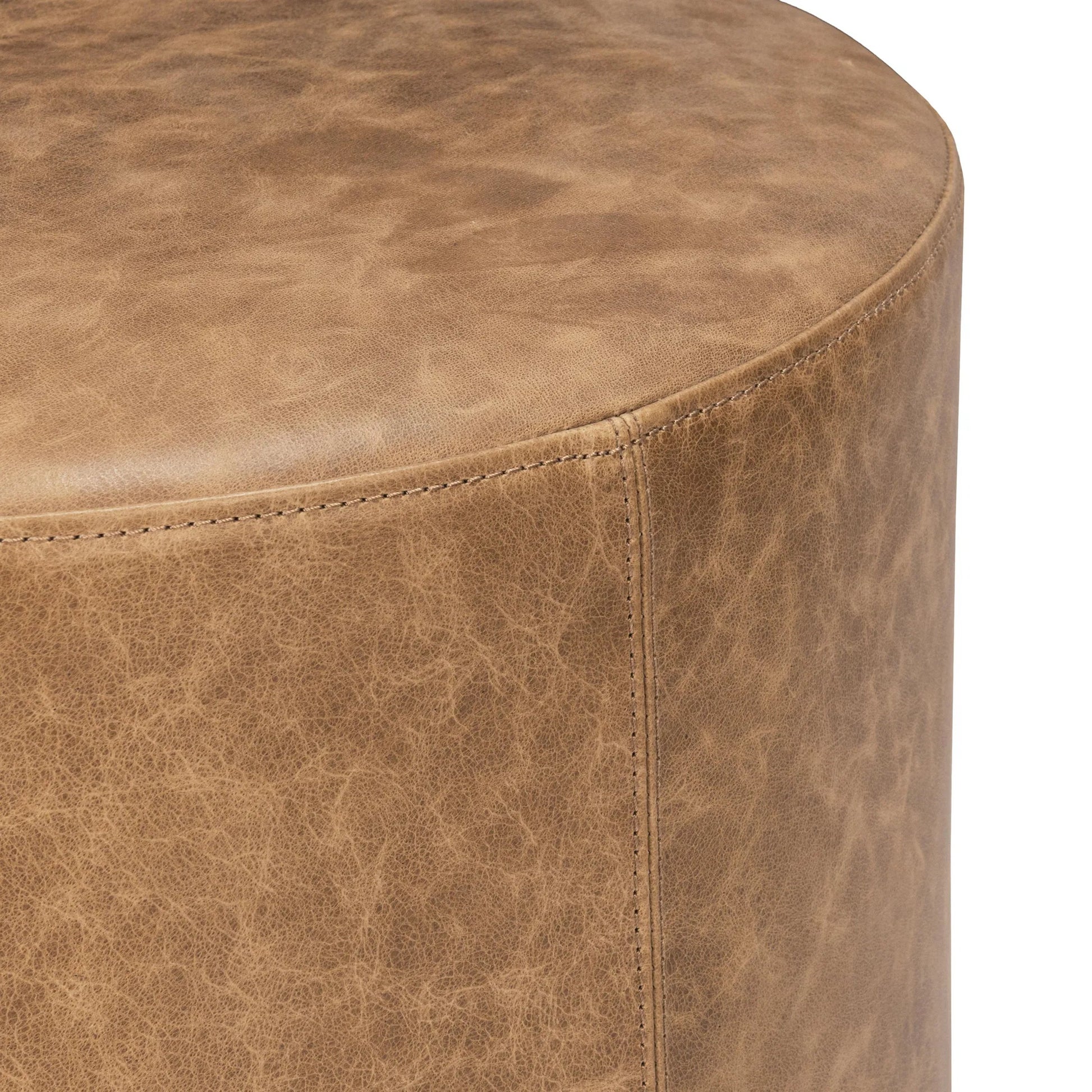 Millo Round Ottoman by Classic Home in sedona brown. Made from top grain leather in a unique style.