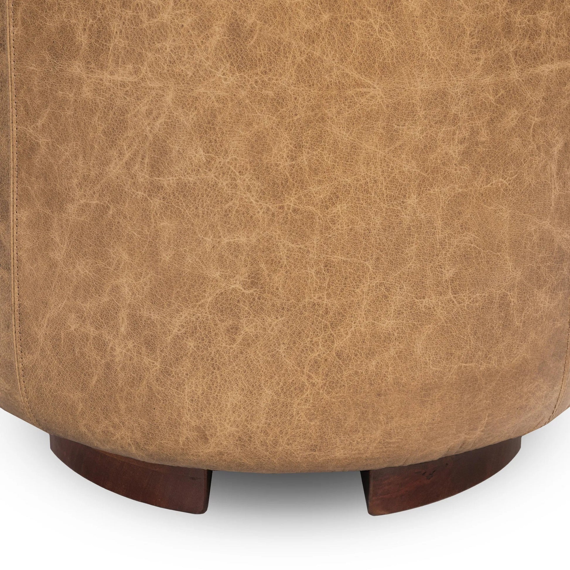 Millo Round Ottoman by Classic Home in sedona brown. Made from top grain leather in a unique style.