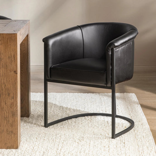 Hester Top Grain Leather Dining Chair by Classic Home in midnight raven. Made from top grain leather, iron in a unique style.