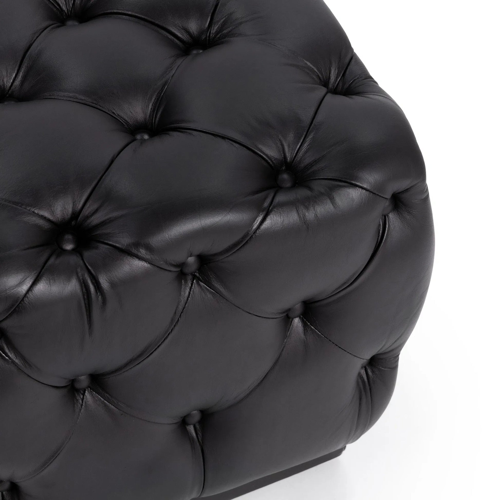 Briar Ottoman by Classic Home in midnight raven. Made from top grain leather in a unique style.
