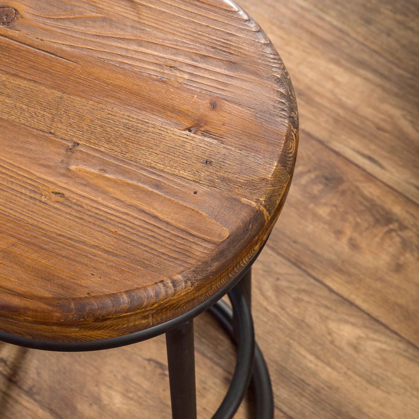 003 SR-897722 | Closeup | Kendall Counter Stool by Kosas Home in mahogany. Made from solid reclaimed pine wood, iron base in a modern style.