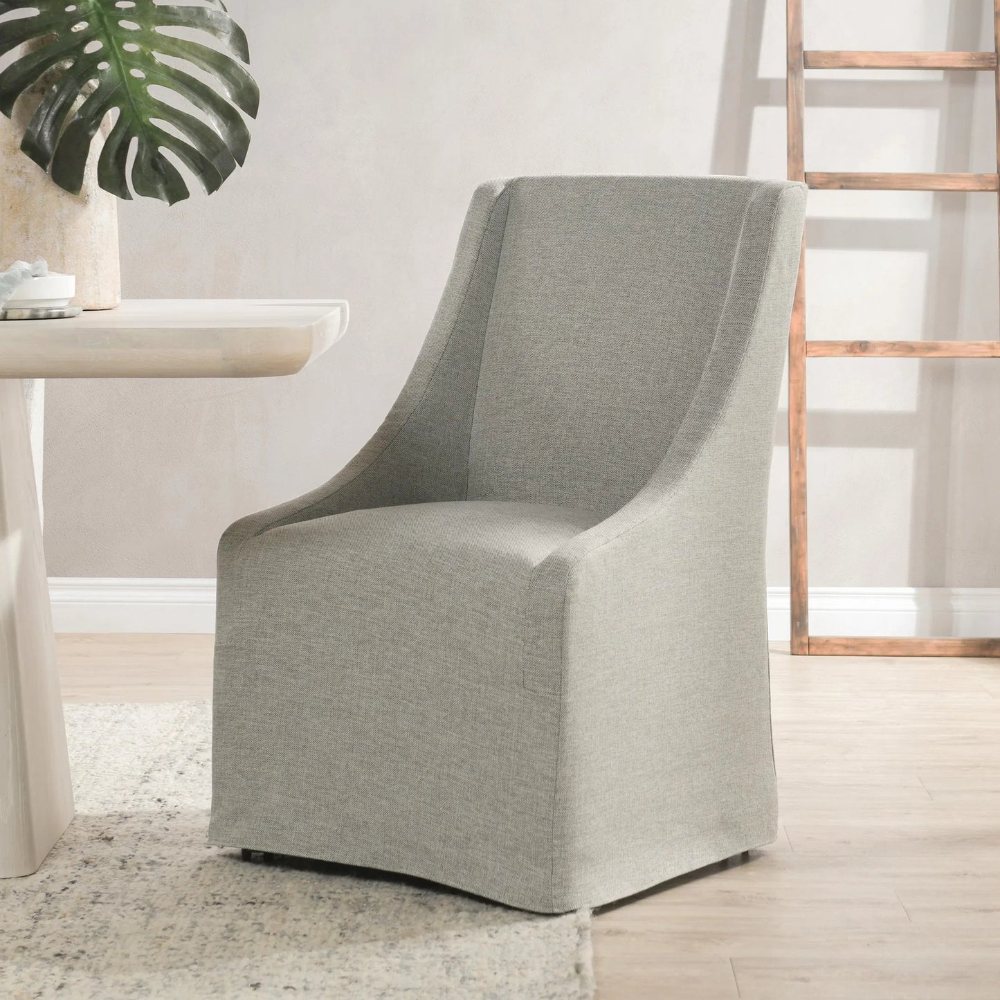 016 SI-2162609 | Lifestyle | Warwick Upholstered Rolling Side Chair by Classic Home. Made from unique in a modern style.