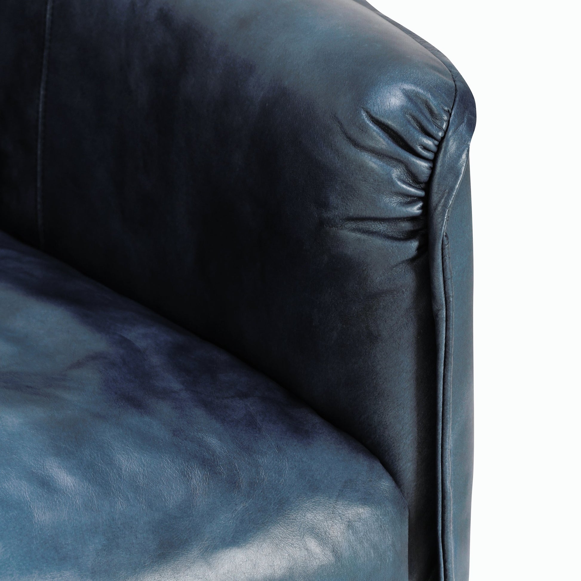 Corinne Club Chair Ocean Blue by Classic Home in ocean blue. Made from buffalo leather, tube iron, plywood, solid wood in a transitional style.