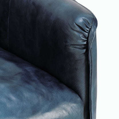 Corinne Club Chair Ocean Blue by Classic Home in ocean blue. Made from buffalo leather, tube iron, plywood, solid wood in a transitional style.