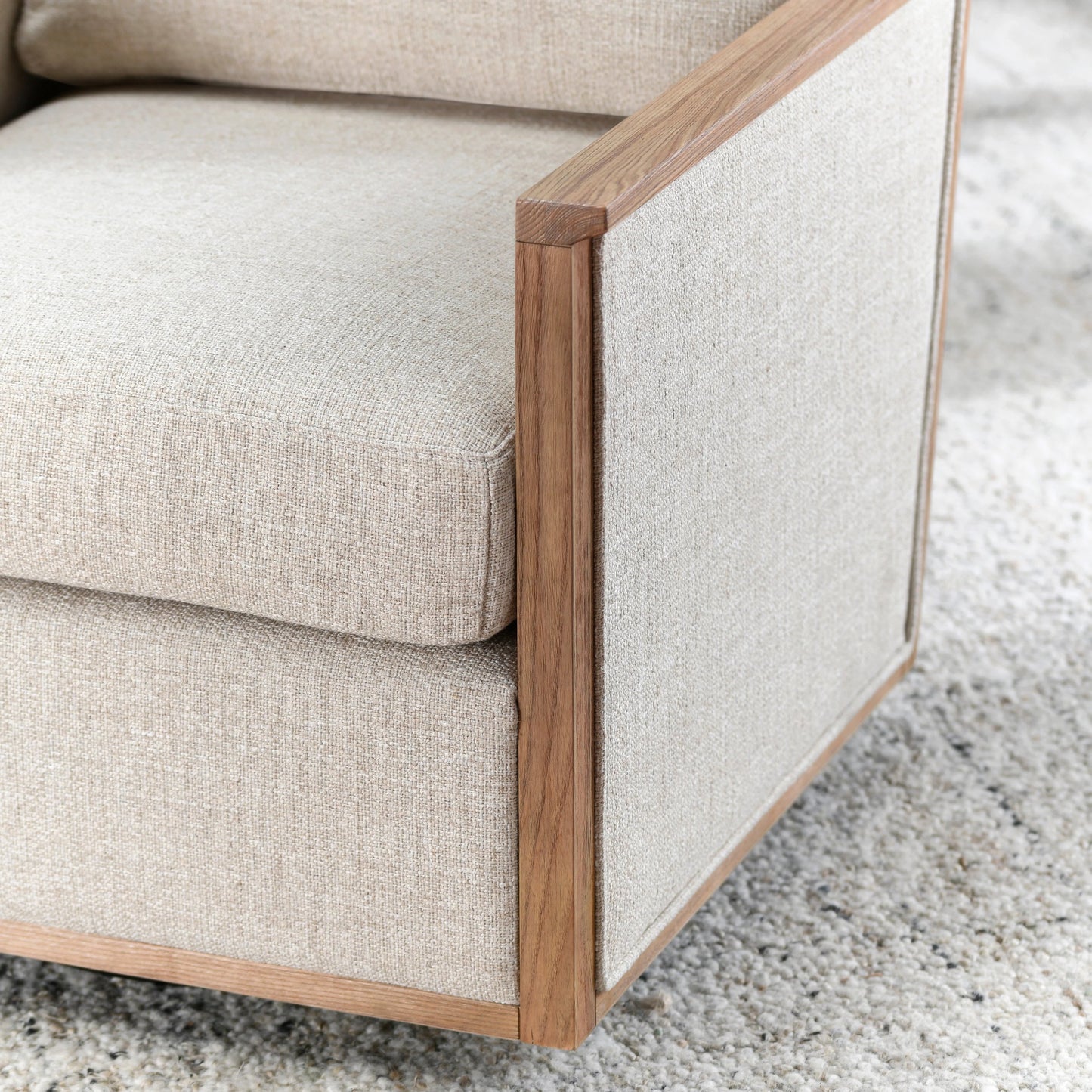 007 SI-2160325 | Closeup | Norman Swivel Accent Chair by Classic Home in natural. Made from ash wood, 88% polyester, 12% linen in a modern style.