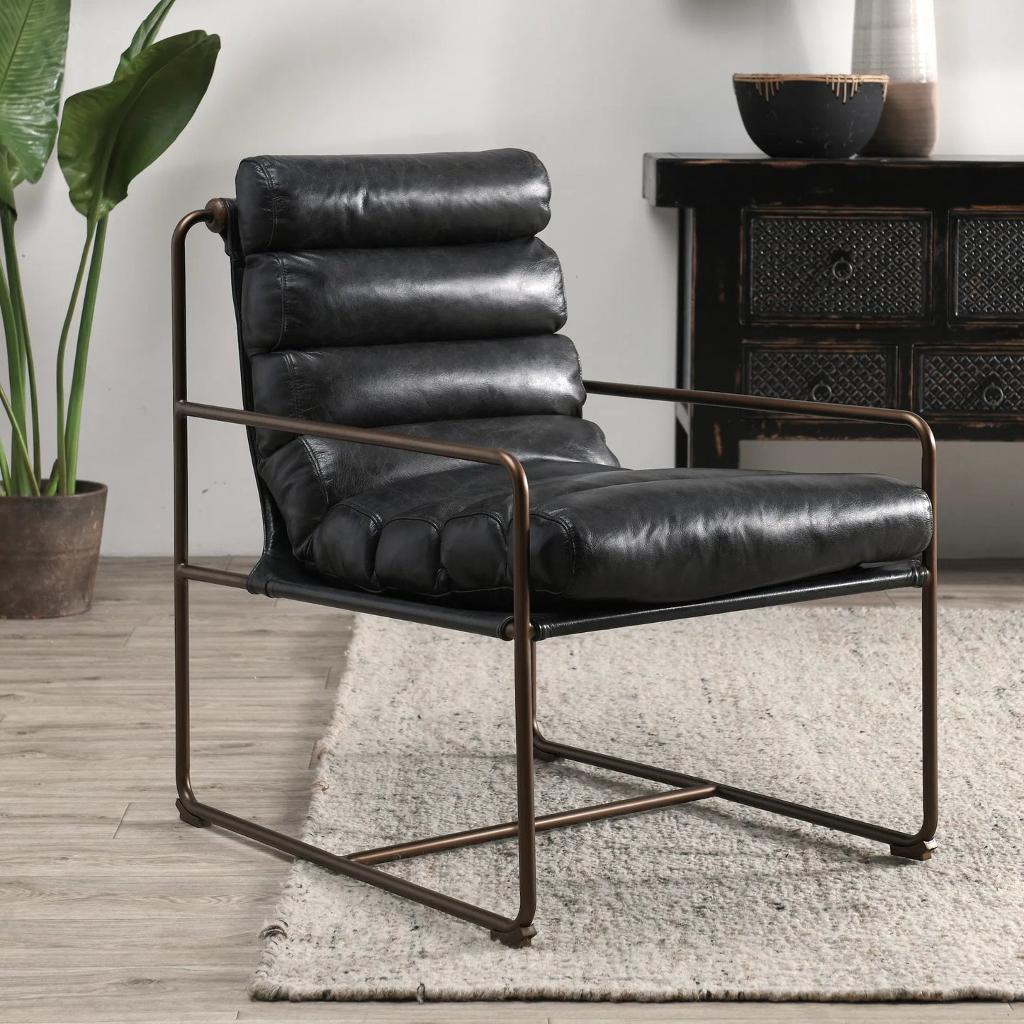 008 SI-2238900 | Lifestyle | Argo Top Grain Leather Black Accent Chair by Classic Home in black. Made from top grain leather, iron in a modern style.
