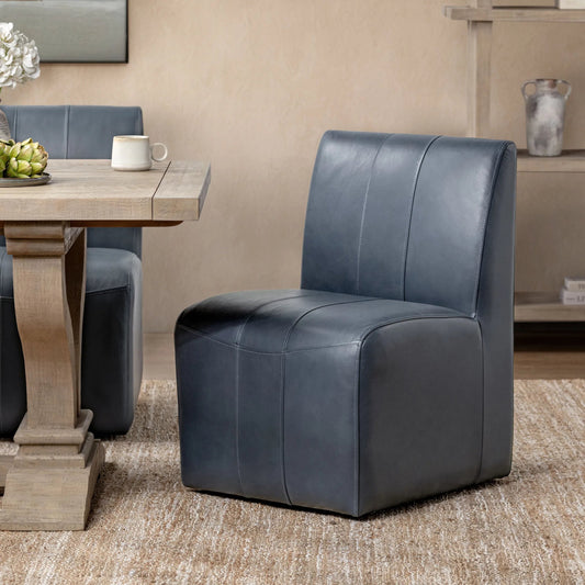 Carsen Dining Chair by Classic Home. Made from top grain leather in a unique style.