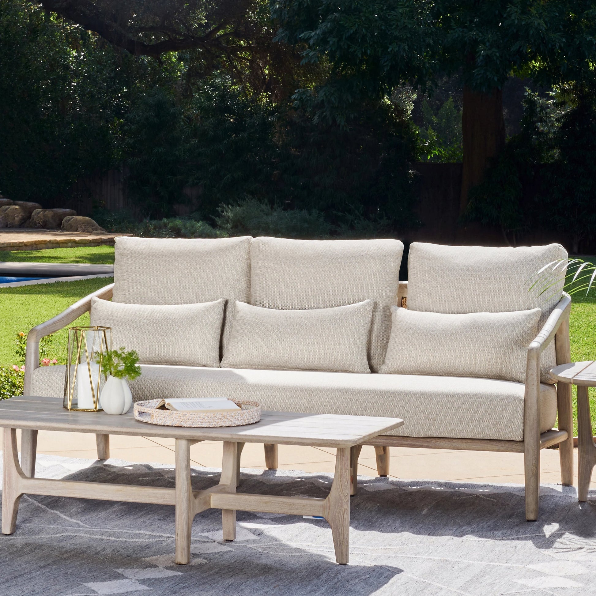 Aria Outdoor Sofa by Classic Home in cream, black. Made from teak wood, wicker, 100% olefin in a modern style.