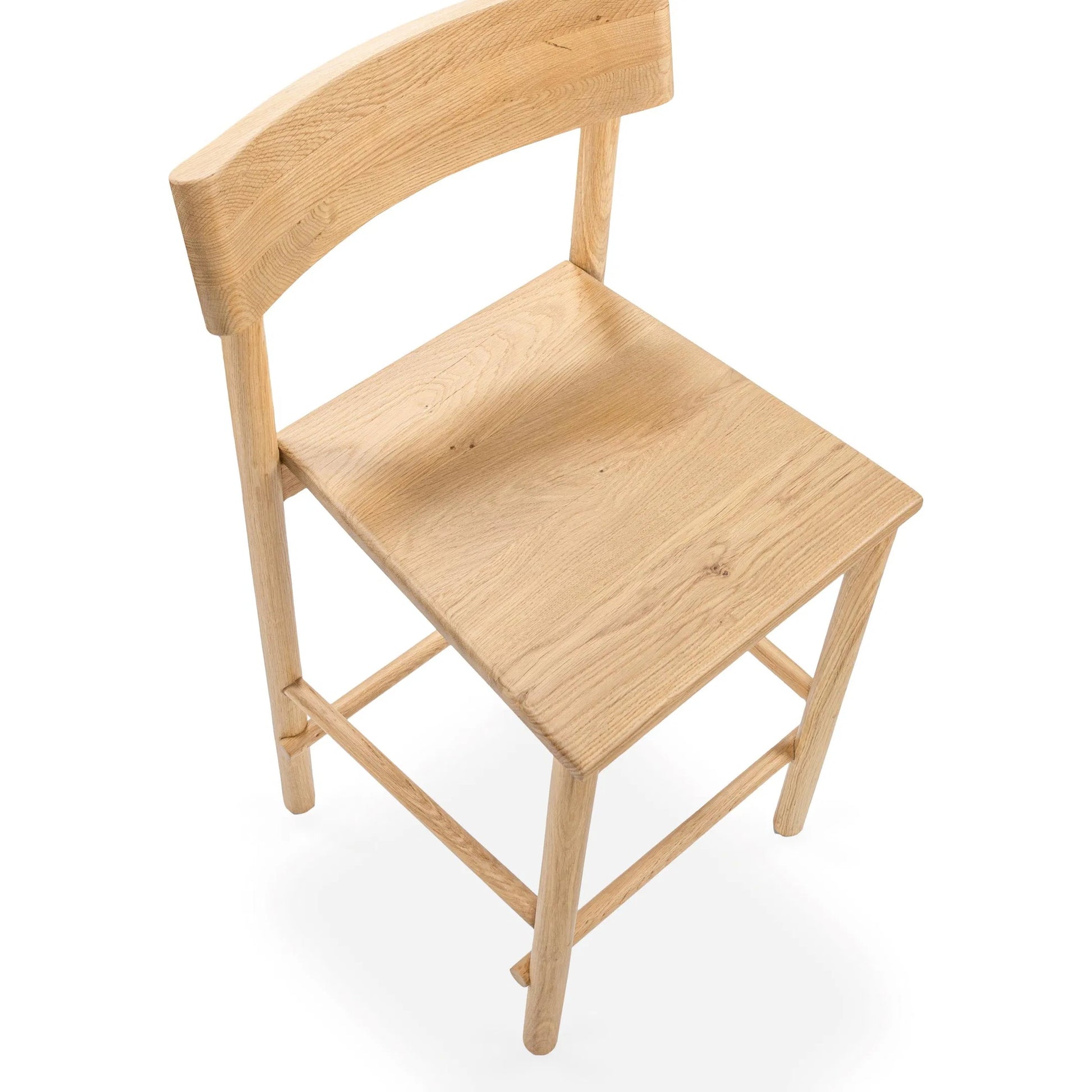 Foundation Oak Wood Counter Height Chair by Classic Home. Made from oak wood in a transitional style.