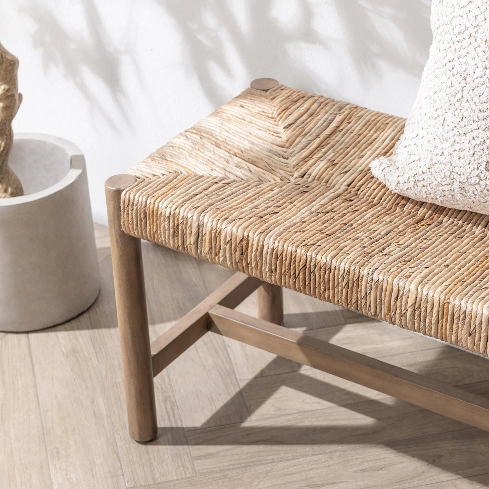 Zaylen Bench by Kosas Home in brown wash. Made from banana bark, mahogany wood in a rustic style.