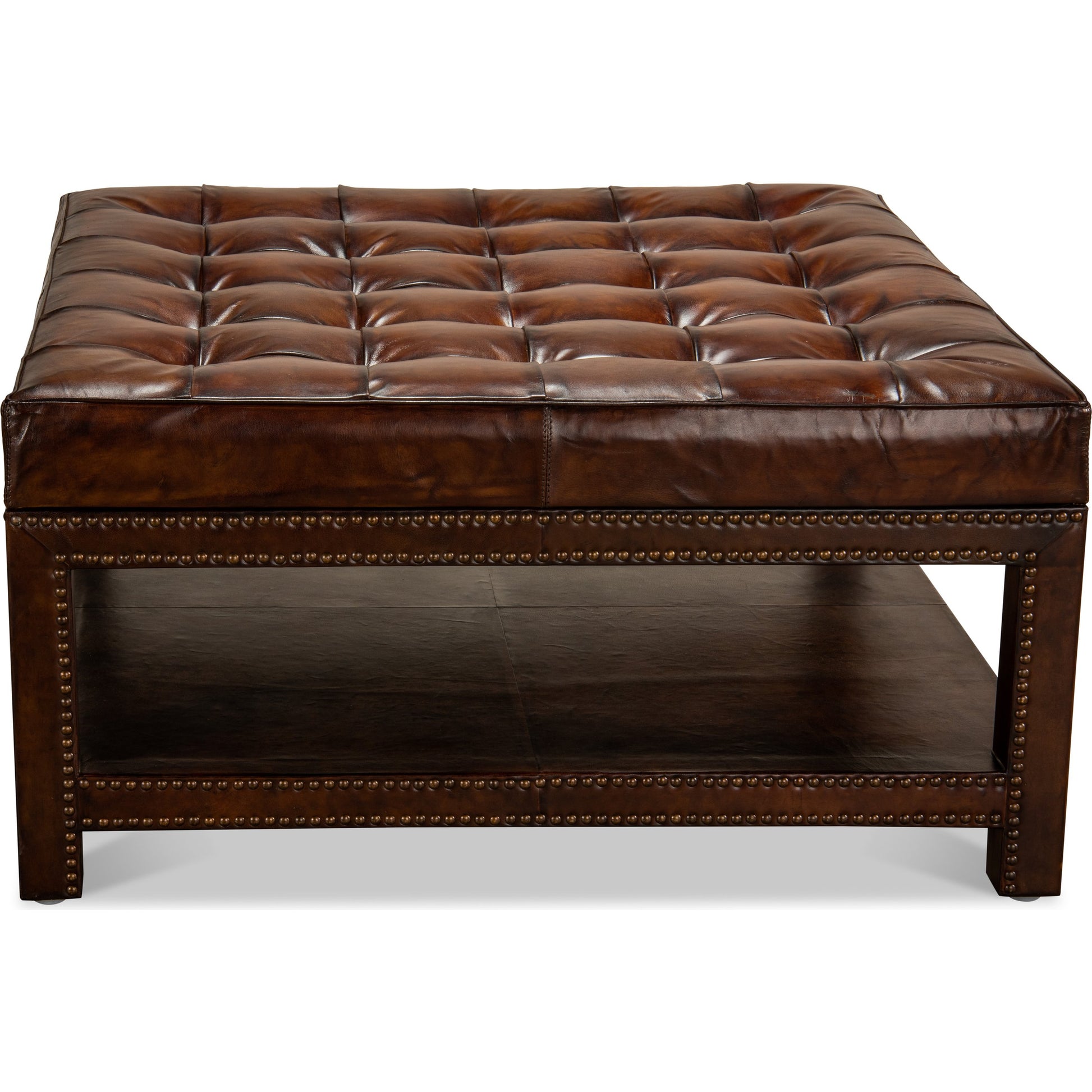 Vintage Tufted Ottoman by Sarreid Ltd. in black and old brown leather brass tacks. Made from hardwood, leather, brass in a rustic style.