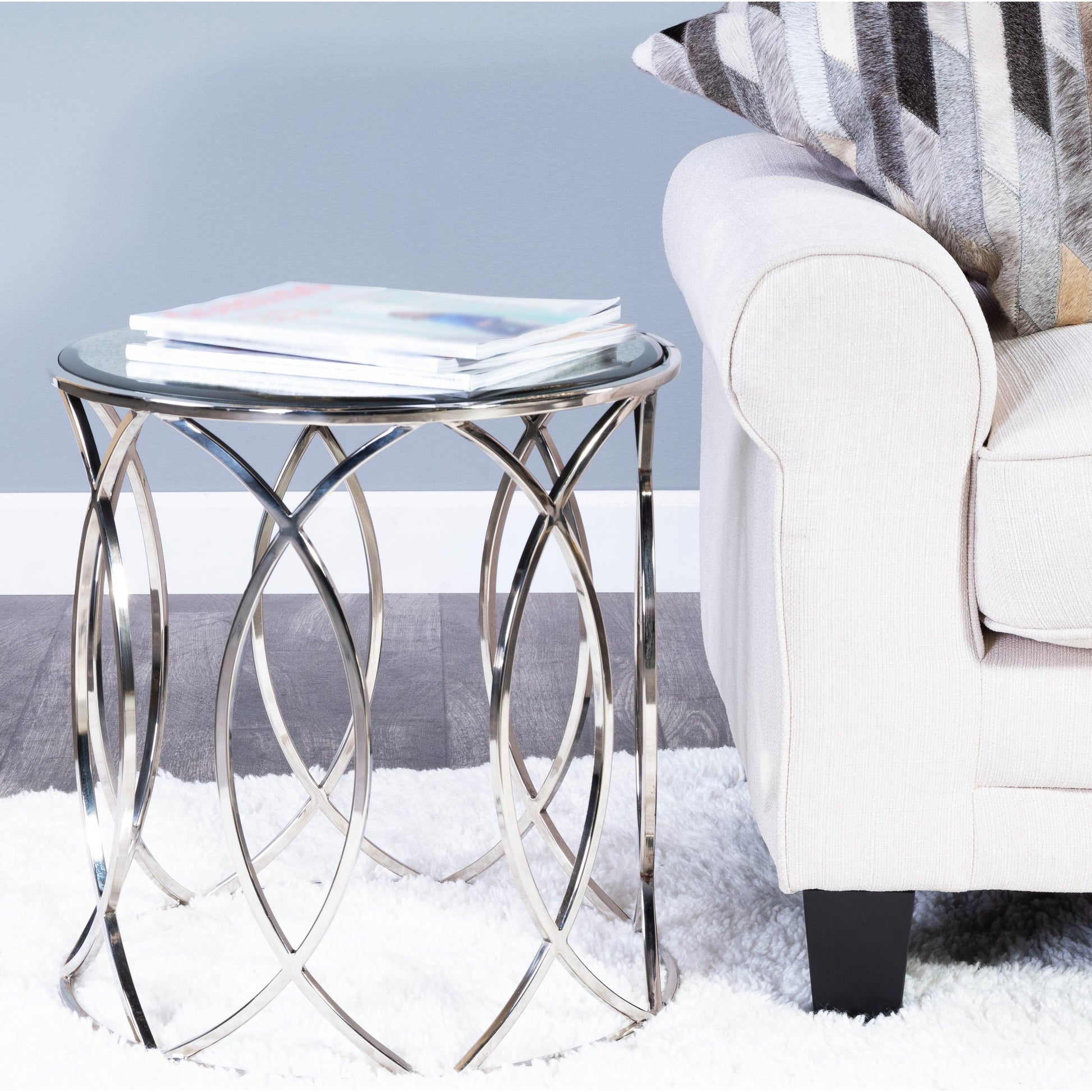 Desiree End Table by Butler Specialty Company in silver and metalworks. Made from stainless steel, mdf, antique mirrored glass with beveled edge in a modern style.