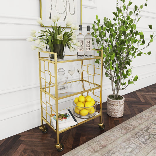 Arcadia Polished Gold Bar Cart by Butler Specialty Company in gold and polished gold. Made from stainless steel (shiny brass finish), glass in a transitional style.