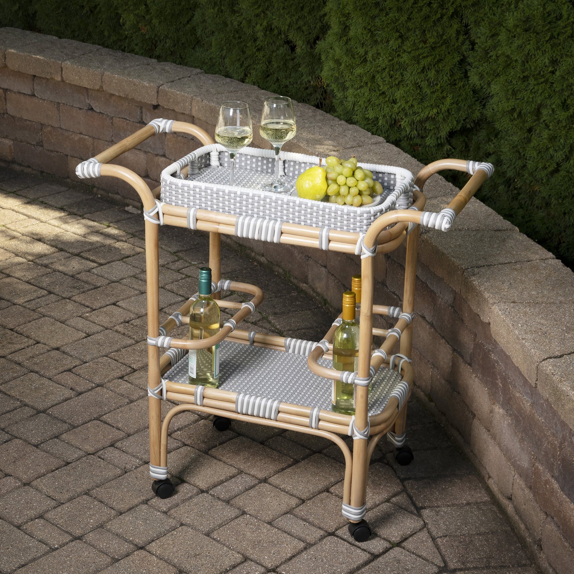 Selena Bar Cart by Butler Specialty Company. Made from rattan, plastic weave in a coastal style.