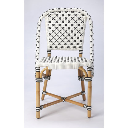 Tenor Dining Chair by Butler Specialty Company in white. Made from 60%-pe plastic weave, 40%-rattan in a coastal style.