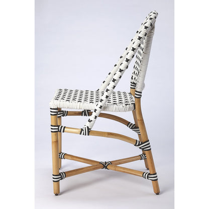 Tenor Dining Chair by Butler Specialty Company in white. Made from 60%-pe plastic weave, 40%-rattan in a coastal style.