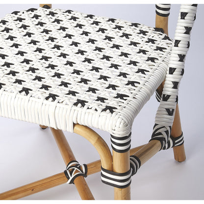 Tenor Dining Chair by Butler Specialty Company in white. Made from 60%-pe plastic weave, 40%-rattan in a coastal style.