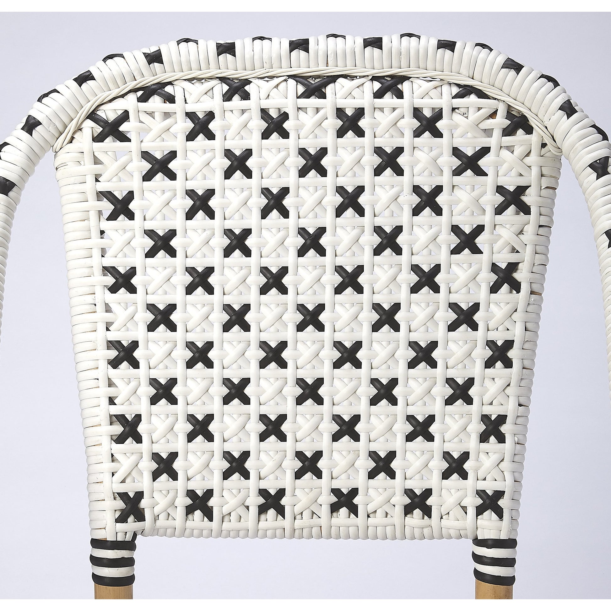 Tenor Dining Chair by Butler Specialty Company in white. Made from 60%-pe plastic weave, 40%-rattan in a coastal style.