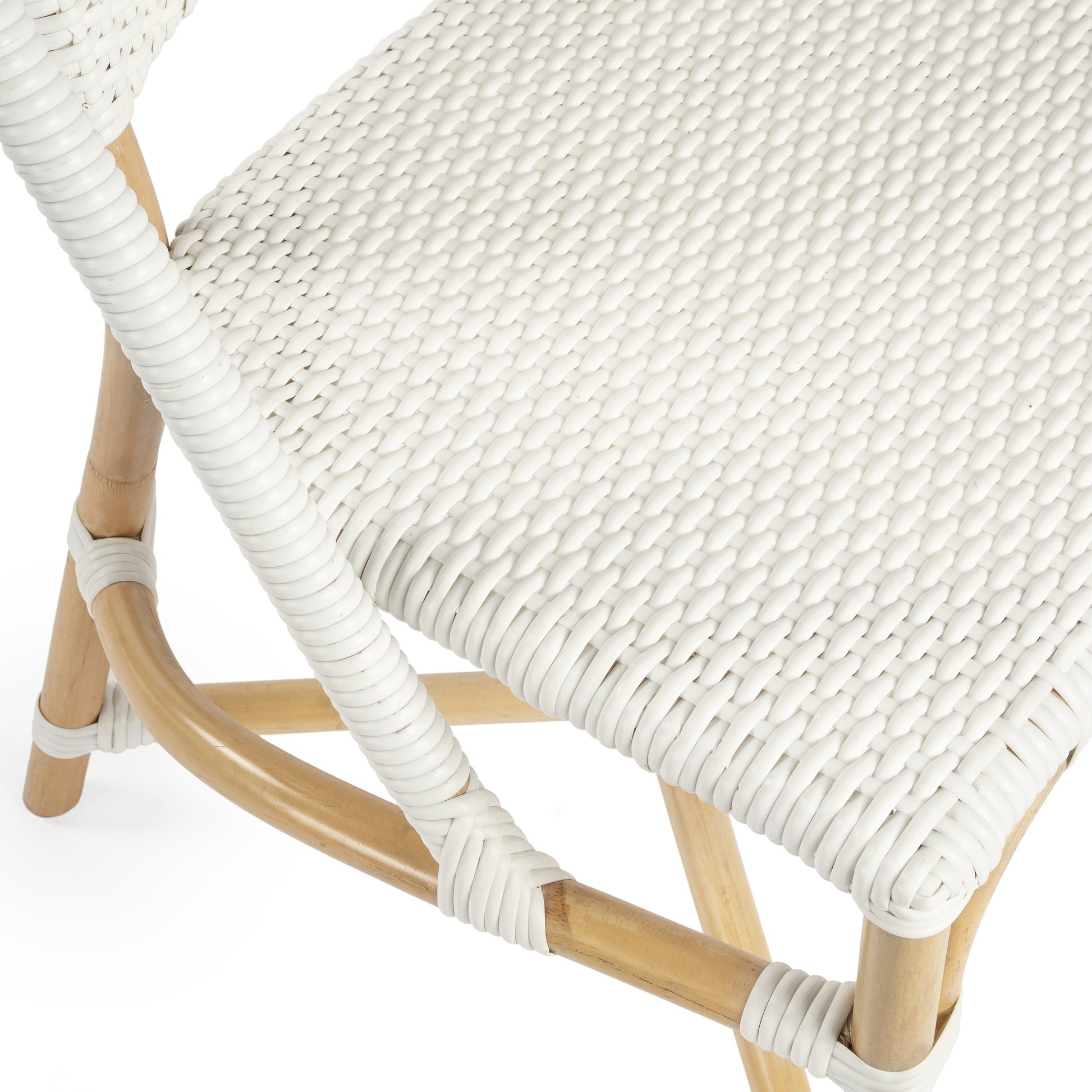 Tenor Dining Chair by Butler Specialty Company in white. Made from 60%-pe plastic weave, 40%-rattan in a coastal style.