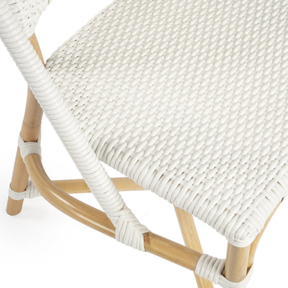 Tenor Dining Chair by Butler Specialty Company in white. Made from 60%-pe plastic weave, 40%-rattan in a coastal style.