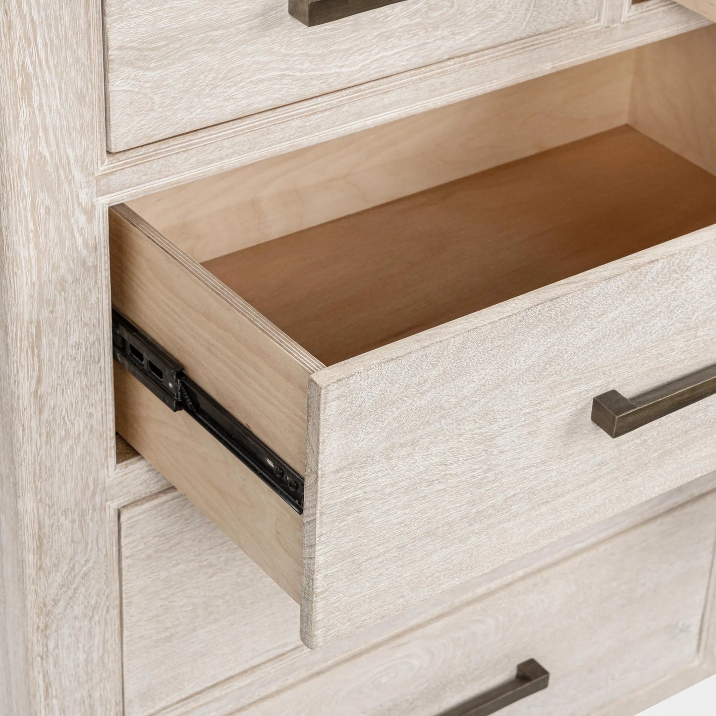 005 SI-2353757 | Closeup | Westmont 9-Drawer Mango Wood Dresser by Classic Home. Made from mango wood in a transitional style.