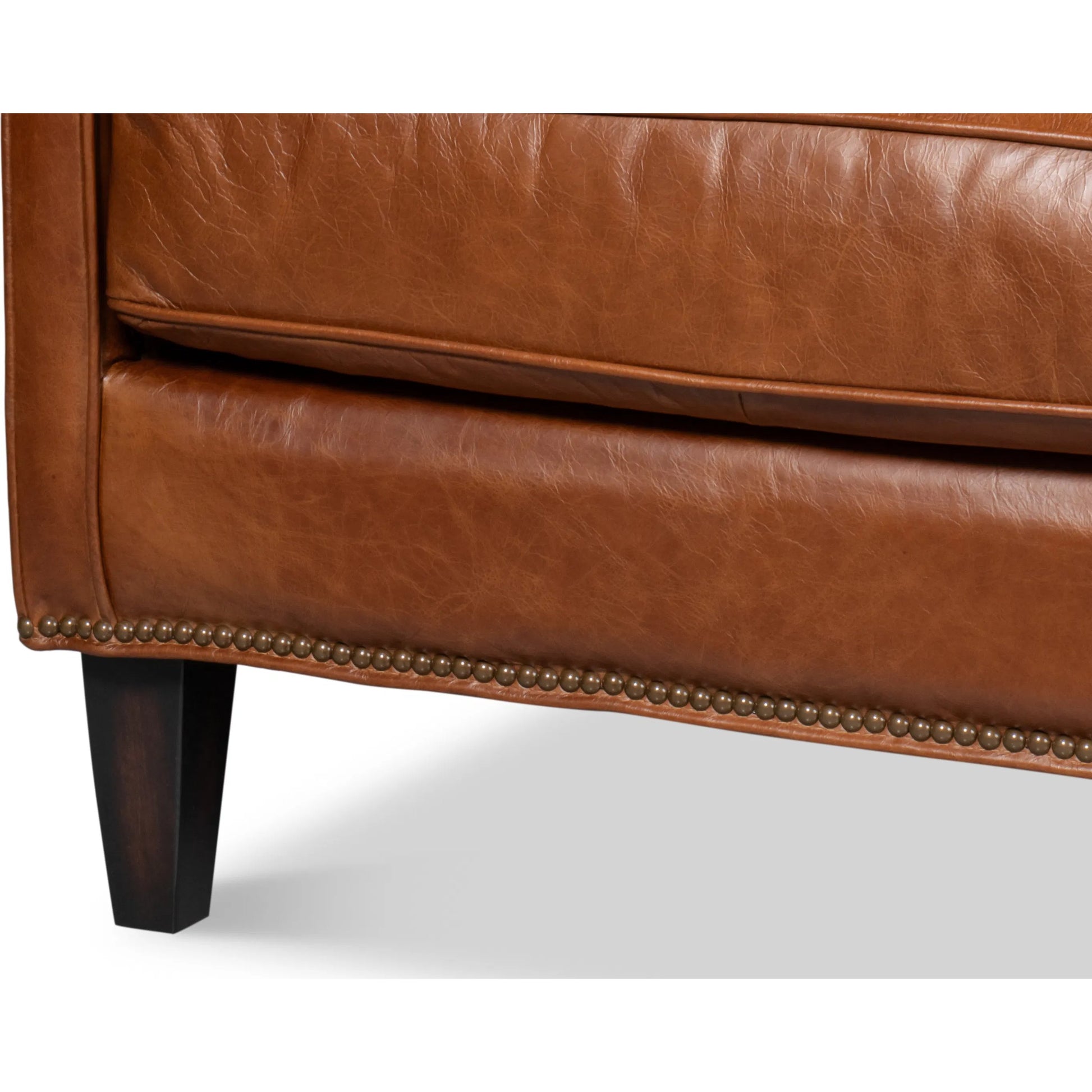 Philipe Distilled Leather Sofa by Sarreid Ltd. in havana brown. Made from leather in a traditional style.