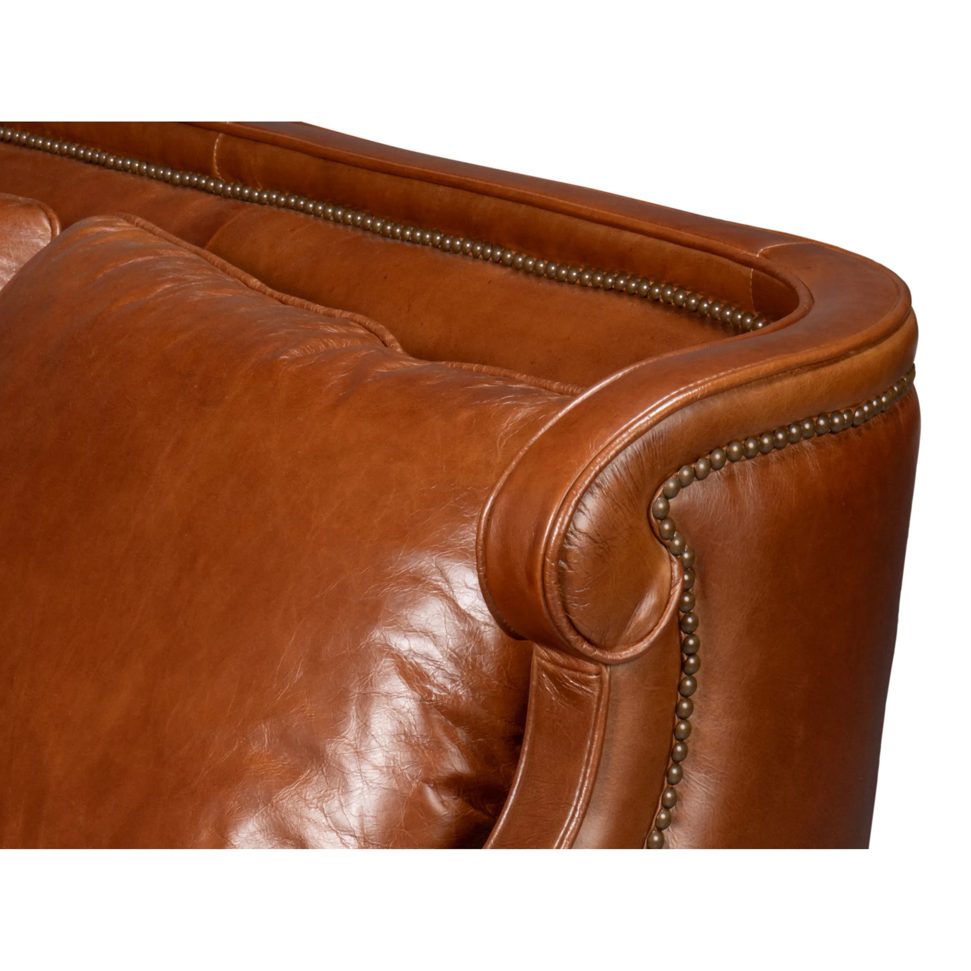 Philipe Distilled Leather Sofa by Sarreid Ltd. in havana brown. Made from leather in a traditional style.