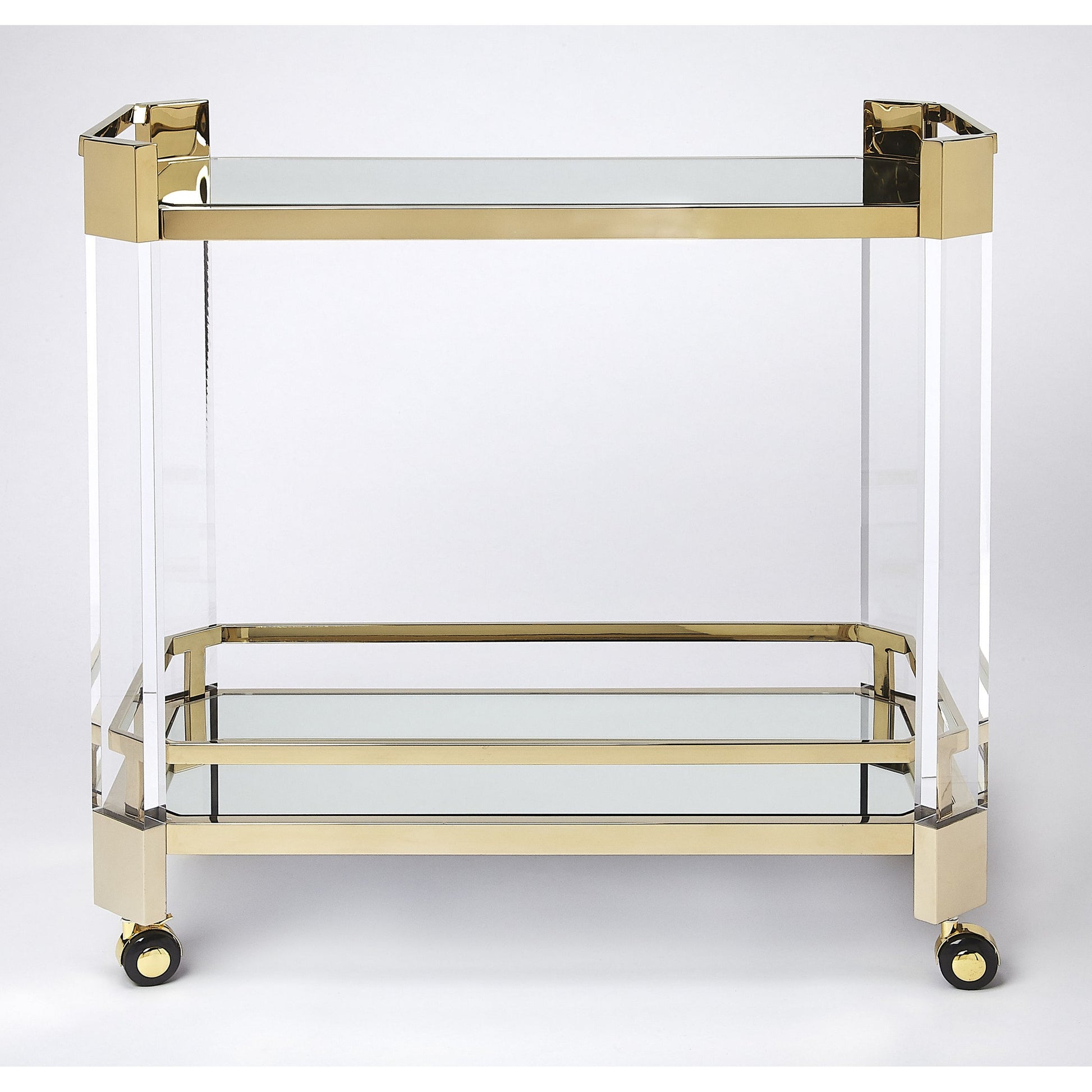Charlevoix Serving Cart by Butler Specialty Company in gold and polished gold. Made from stainless steel, high polished gold, acrylic, clear glass, mirror glass, stainless steel casters, high polished gold finish in a tran