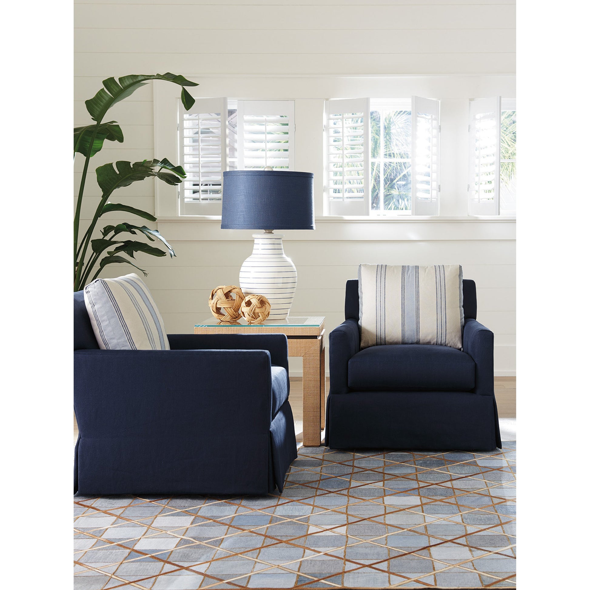 Harlow Swivel Chair by Barclay Butera in navy. Made from unique in a traditional style.